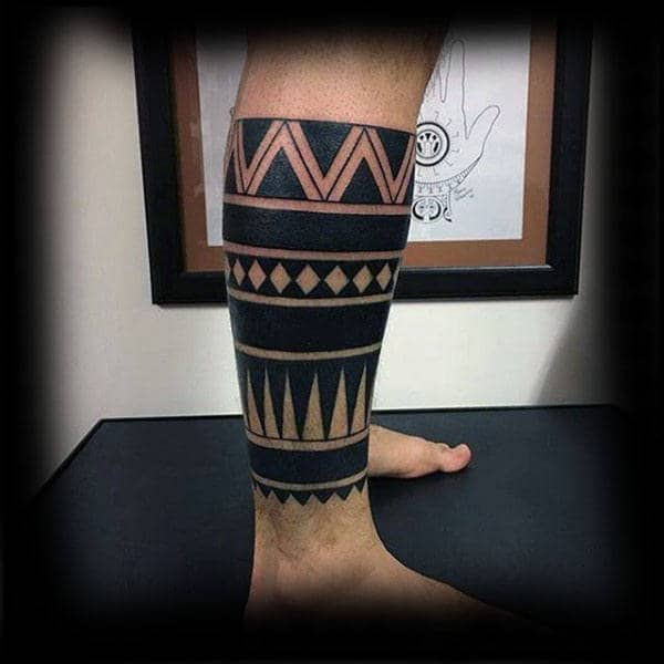 mens lower leg sleeve tribal negative space tattoo designs